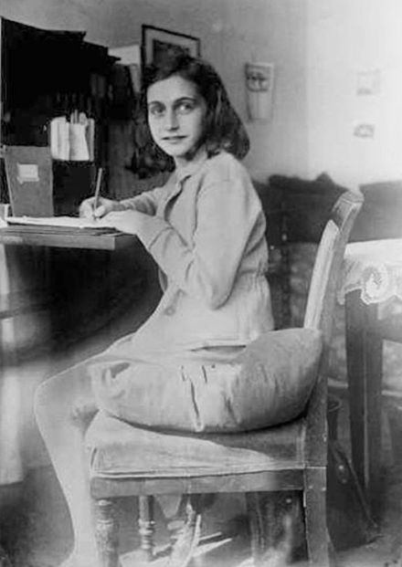 Anne Frank writing at her desk, Merwedeplein, 1941